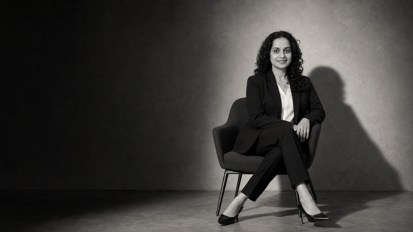 Anamika Yadav seated in a cinematic studio portrait